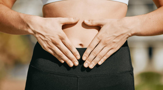 Focus on abdominal area, illustrating link between posture and digestion.