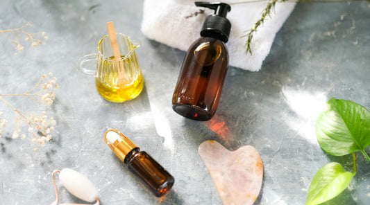 Wellness-themed flat lay with beauty oils and rollers, showcasing gift ideas for all budgets.