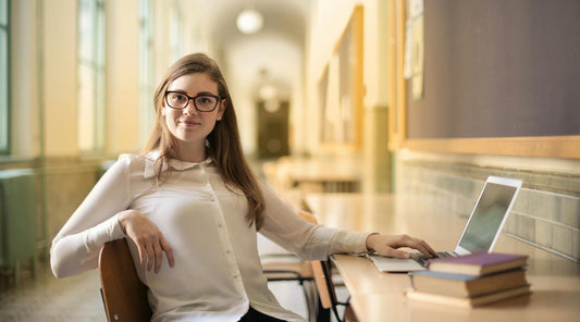 Woman sitting on a chair leaning backward.