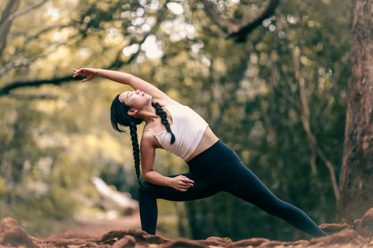 Woman doing yoga side stretch for posture improvement.