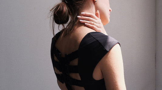 Woman wearing Etalon posture bra for back support benefit.