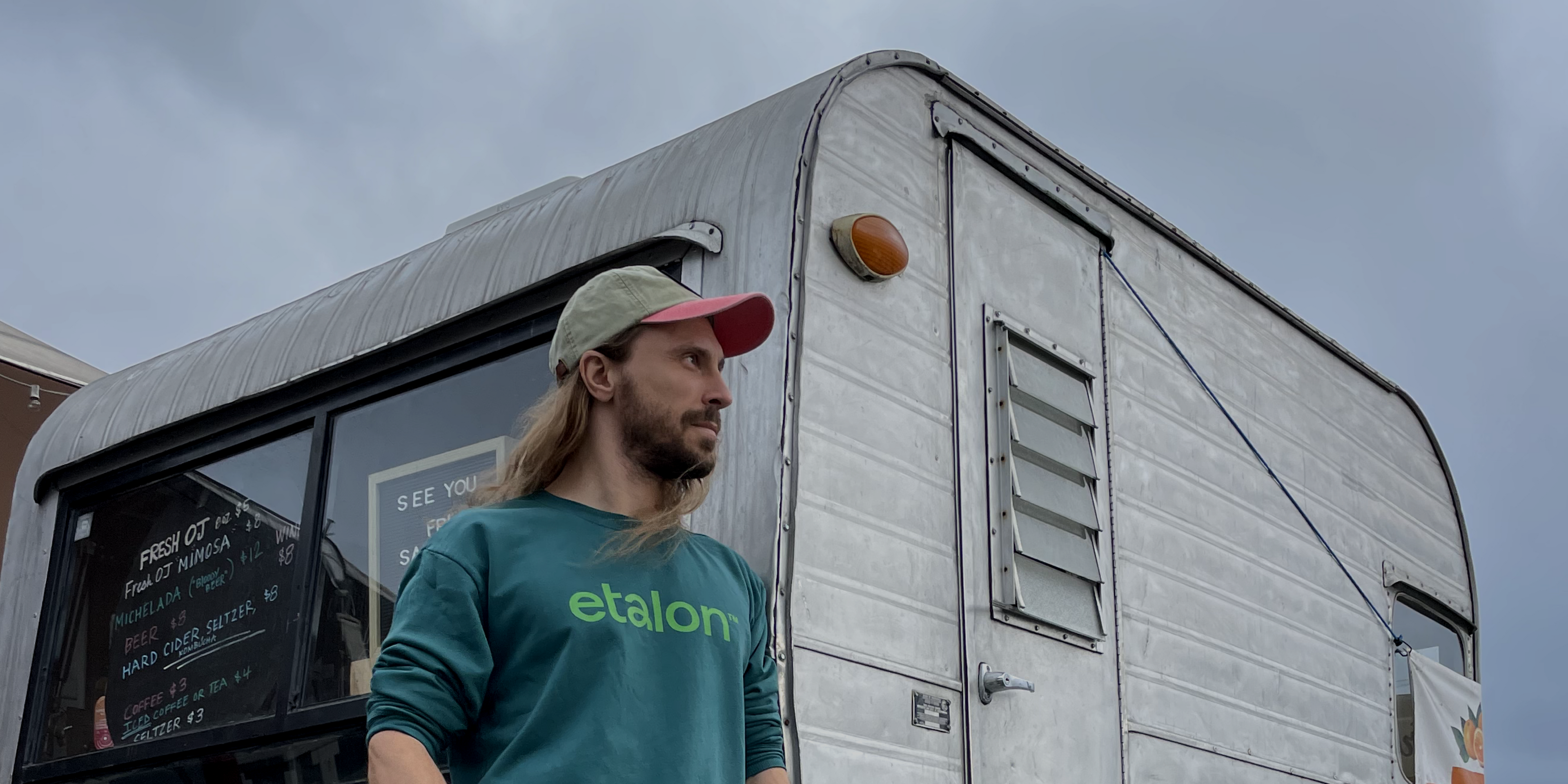 A man sporting the Etalon sweatshirt outdoors, reflecting a relaxed, posture-aware lifestyle.