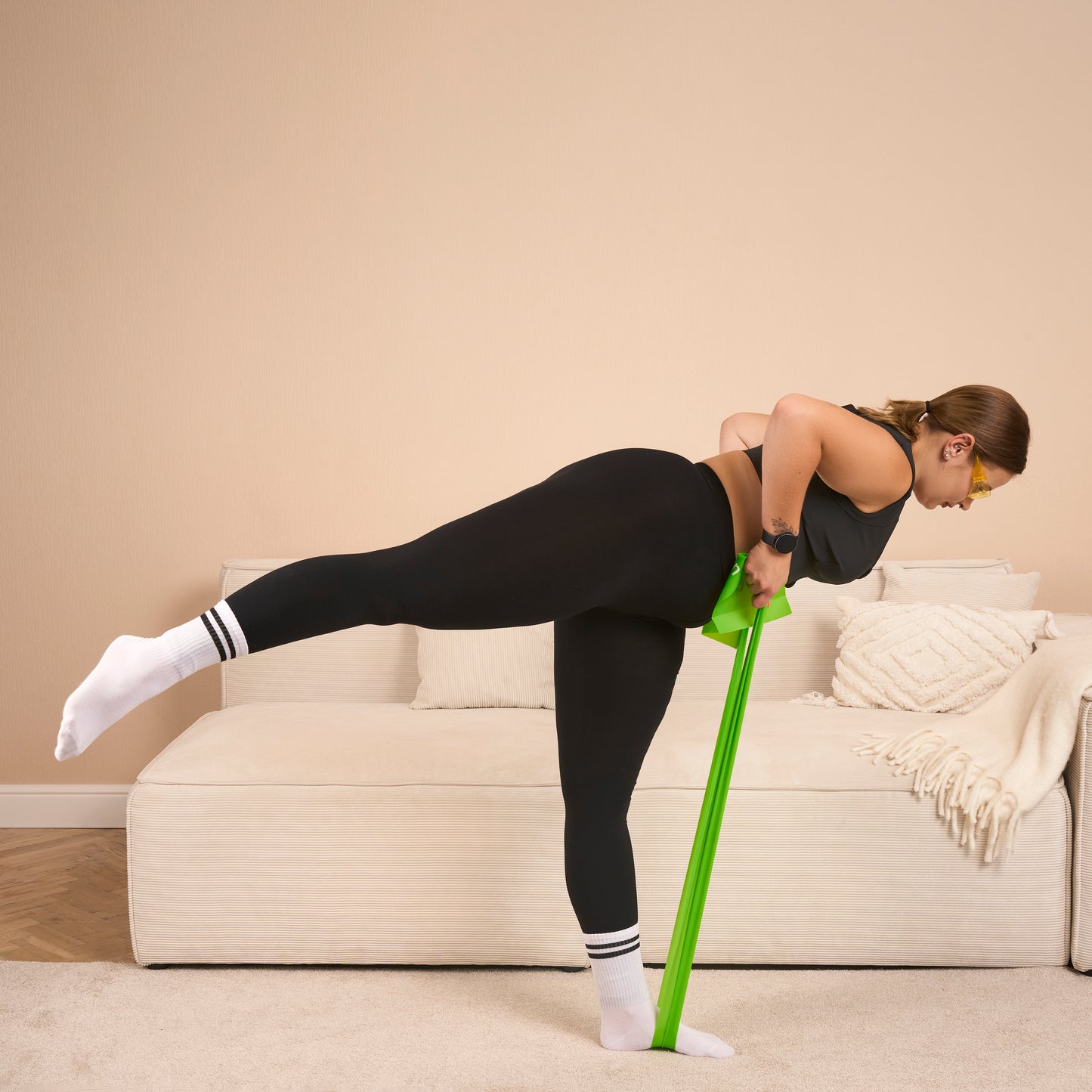 Exercises with a green Etalon fitness band for glute and core strength.