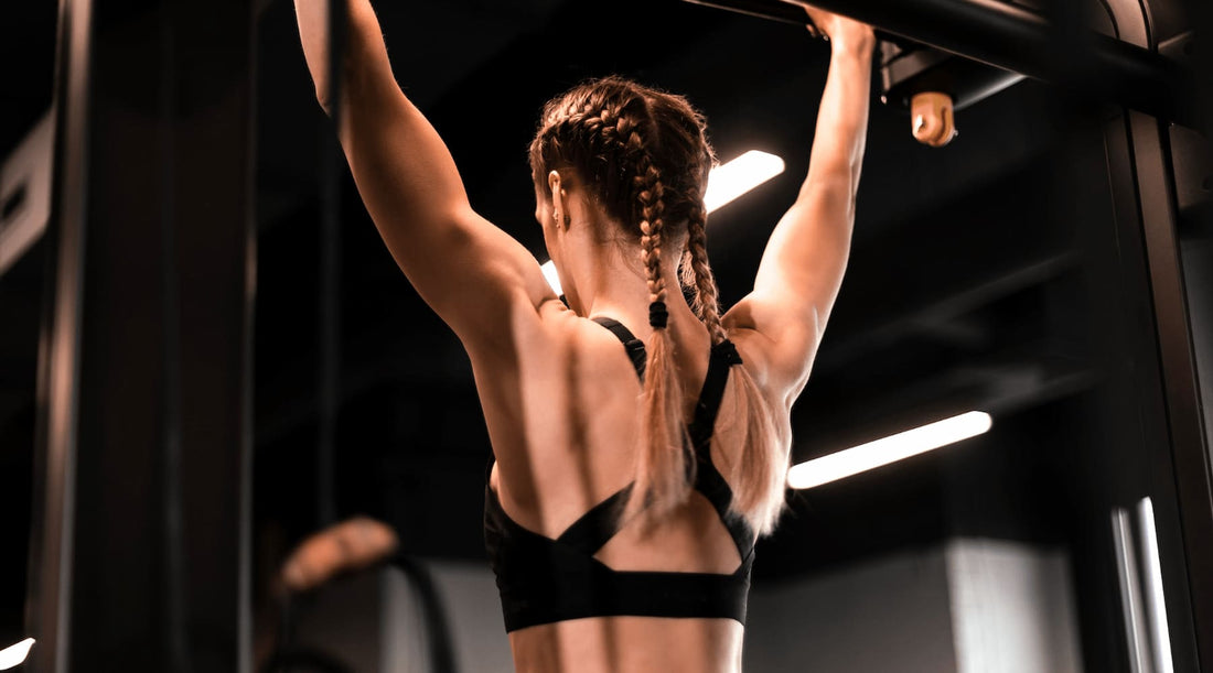 Fit woman training in gym, wearing posture bra for support and performance.