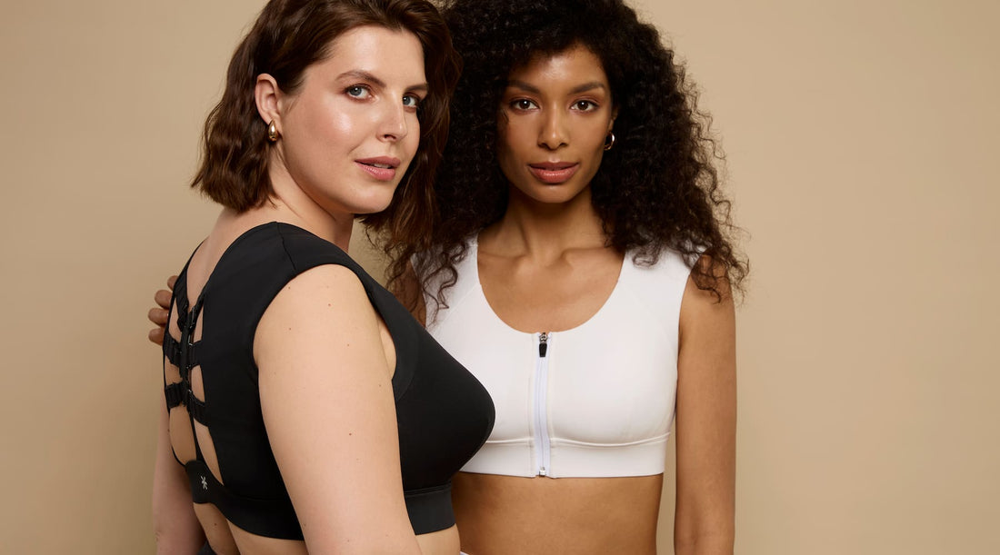 Two women wearing black and white Etalon posture bras, highlighting the improved 2.0 version.
