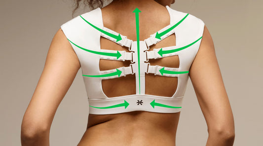 Close-up of supportive straps on white Etalon posture bra being worn, illustrating orthopedic posture benefits.