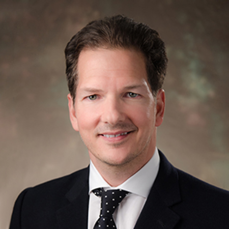 Headshot of Dr. Chris Ames, Professor of Neurosurgery and Orthopedic Surgery at UCSF and Etalon advisor, providing expert endorsement on posture correction and back support.