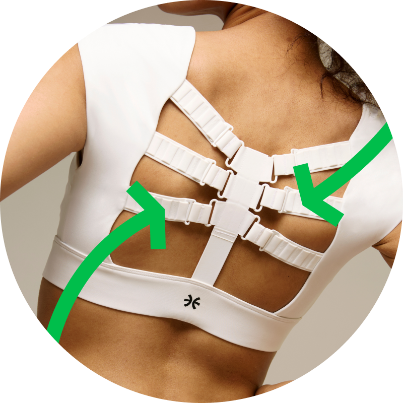 Back view of a woman wearing the white Etalon posture bra showing six adjustable straps for comprehensive upper‑back support and posture correction.